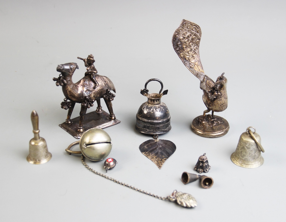 A selection of middle eastern silver and white metal objects of virtue, to include a peacock, 12cm