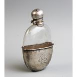A Victorian silver mounted hip flask, William Hutton & Sons, London 1896, the oval flask mounted