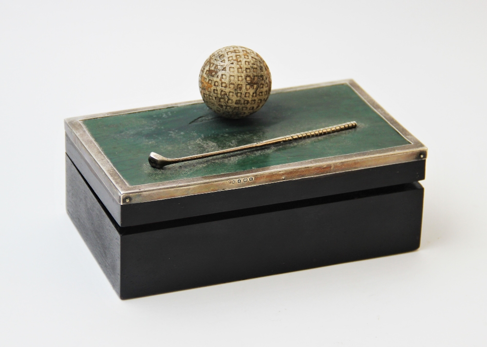 Golfing interest: A George V silver mounted cigarette box, Sanders & MacKenzie, Birmingham 1929, the