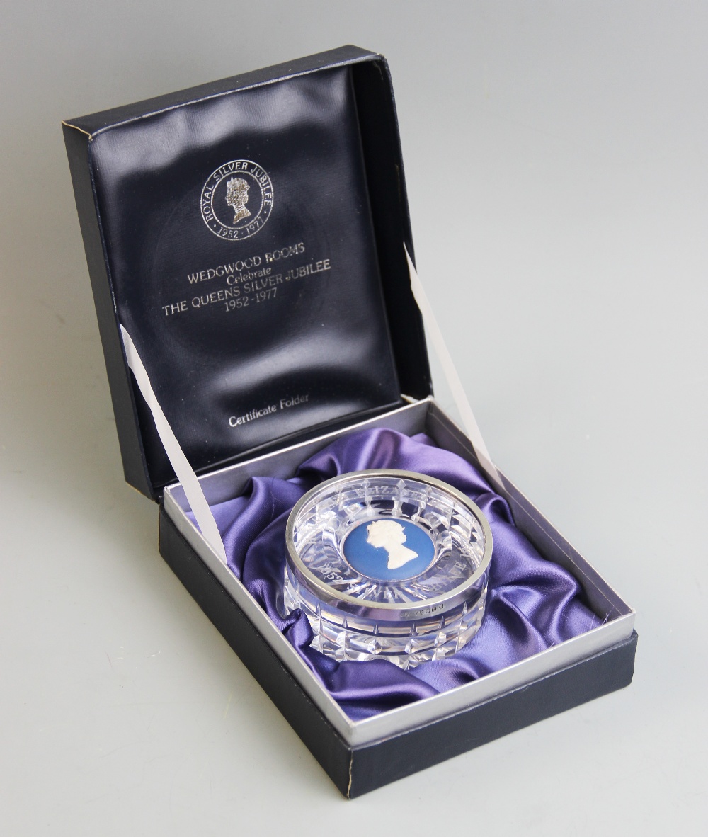 A Wedgwood cut glass, silver mounted 'Silver Jubilee' paperweight, commemorating the Silver
