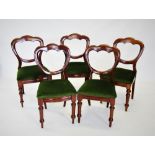 A matched set of ten Victorian mahogany crown back dining chairs, each with a serpentine stuff