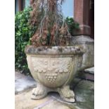 A pair of reconstituted stone garden jardinieres/planters, each of large circular form cast with oak