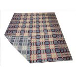 A Welsh woollen blanket, in a traditional reversible pattern in claret, blue, yellow and orange,