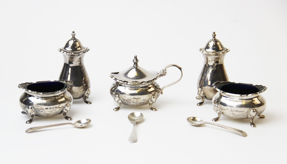 A George V silver condiment set, Adie Brothers, Birmingham 1925, each of squat baluster form with