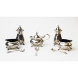 A George V silver condiment set, Adie Brothers, Birmingham 1925, each of squat baluster form with