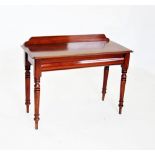 A Victorian mahogany side table, with a galleried back above the rectangular thumb moulded top and