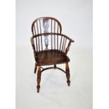 A late 18th/early 19th century elm and ash windsor elbow chair, the hoop back with a central pierced
