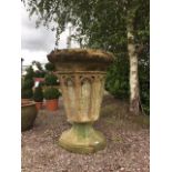 A large pair of reconstituted stone jardinieres/planters of Gothic design, each of octagonal