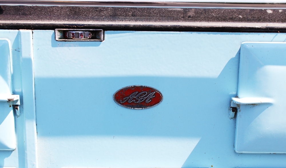 A mid 20th century pale blue Aga, the black top with two chromed hinged hob covers above a chromed - Bild 2 aus 5