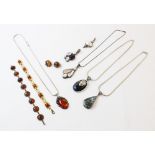 A quantity of silver jewellery set with amber and assorted semi-precious stones, to include, a large