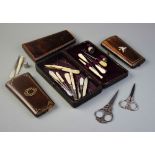 A collection of sewing implements and associated cases, to include mother of pearl handled button