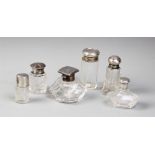 Six assorted glass and silver topped dressing table jars, to include a faceted square example,