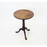 A George III mahogany birdcage tripod occasional table, the circular top raised on turned and