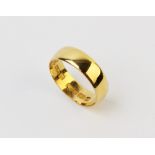 A 22ct gold wedding band, weight 3.6gms