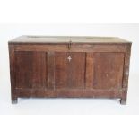 A pair of mid 18th century oak estate storage chests, the hinged tops enclosing a vacant interior,