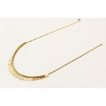 A 9ct gold fringed collarette, the tapering fringe drop with engine turned decoration, measuring