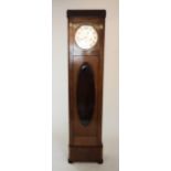 An early 20th century walnut cased long case clock, with a 26cm diameter silvered dial and three