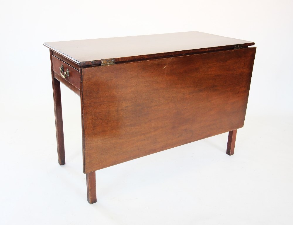 A George III mahogany single drop leaf table, the rectangular top above a single frieze drawer,