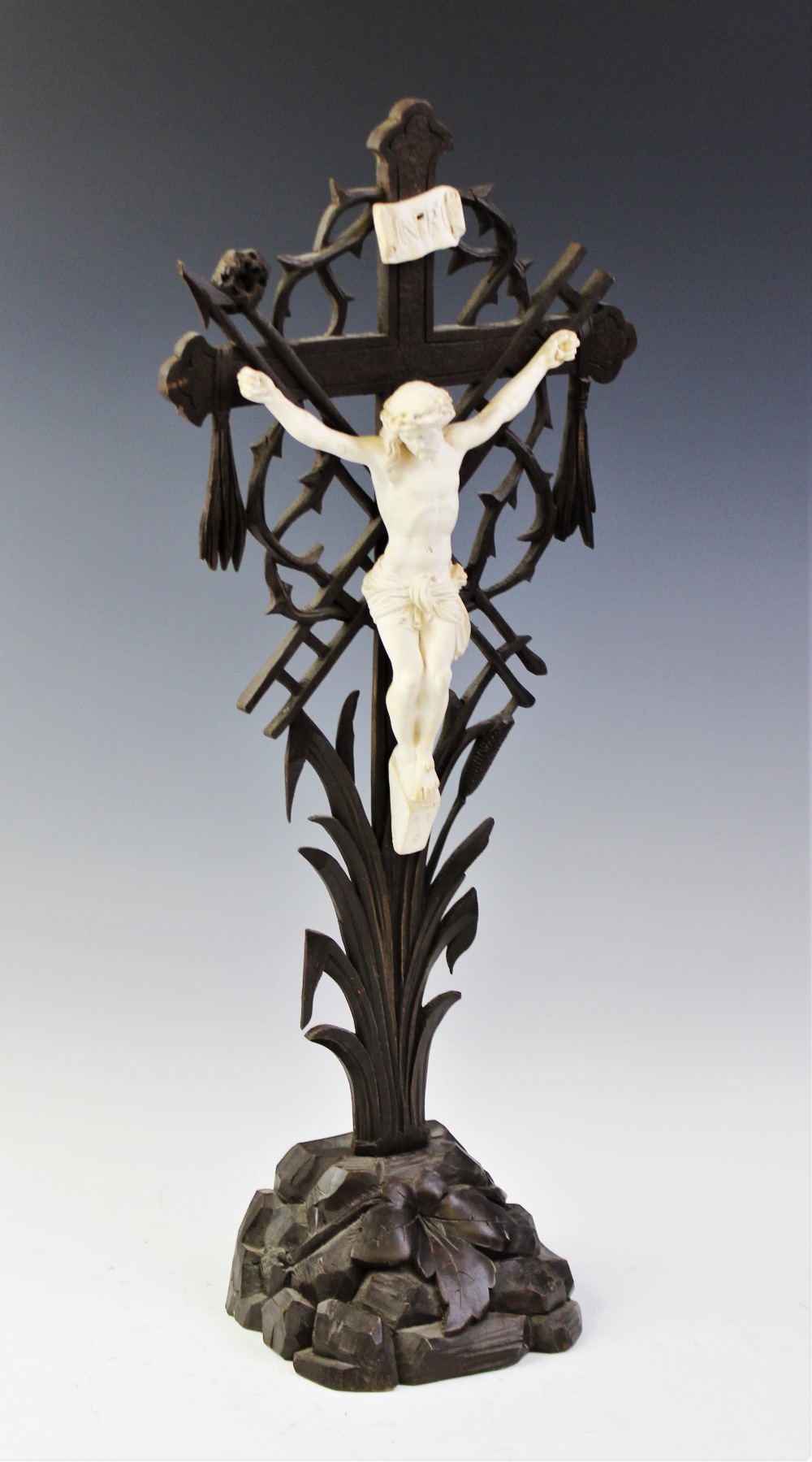 A carved Black Forest crucifix, early 20th century, Christ modelled in plaster of Paris and designed - Image 2 of 2