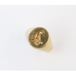 A 9ct gold signet ring, the central cartouche with engraved crest of a griffin head above a coronet,