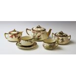 A Japanese Satsuma tea service, 20th century, comprising; six tea cups and saucers, a teapot, milk