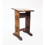 A late Victorian oak lectern, the angled book rest raised upon two rectangular uprights, the left