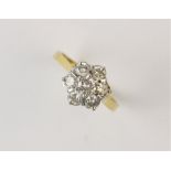 A diamond floral cluster ring, the central round brilliant cut diamond weighing approx. 0.25ct, with