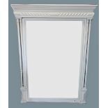 A Victorian painted over mantel mirror, with a moulded cornice above a gadrooned frieze and a