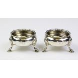 A pair of George III silver salt cellars by D & R Hennell, London 1759, of cauldron form with