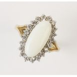An opal cluster ring, comprising a central oval white opal cabochon measuring 15mm x 7mm, with a