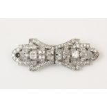 An Art Deco diamond set 18ct white gold double clip brooch, each detachable clip set with a square