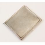 A silver cigarette case by A Wilcox, Birmingham 1940, of rectangular form with engine turned