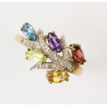 A diamond and topaz 'tutti-frutti' dress ring, designed as a blossoming branch, comprising five