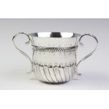 A 17th century style Britannia silver porringer by Harry Freeman, London 1911, of typical form