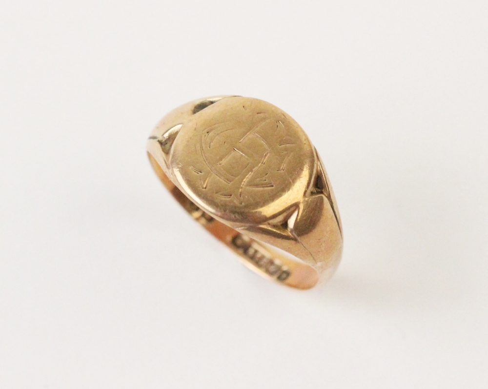 A 9ct gold signet ring, the central panel engraved with monogrammed initials 'CH', to a tapering