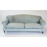 A 19th century style sofa, late 20th century, in pale blue fabric, the arched padded back above