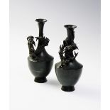 A pair of Japanese bronze vases, Meiji period (1868 - 1912), each of waisted cylindrical form and