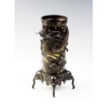 A Japanese bronze brush pot on stand, Meiji period (1868 - 1912) the cylindrical pot gilt