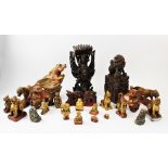 A collection of Middle Eastern carved wood figures, 19th century and later, to include, a pair of