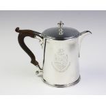 A George III silver hot water jug, London 1790, of tapered cylindrical form with scrolling wood