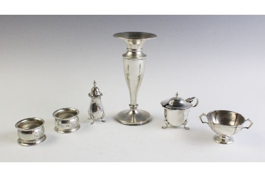 A selection of silver tableware, to include, an Edwardian weighted silver posy vase, Chester 1901, a