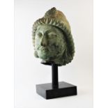 A Chinese Tang dynasty style bronze model of a head, modelled realistically with moustache and