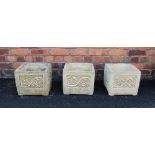 A trio of 'Cotswold Studio' reconstituted stone planters, each of cubic form with foliate detail