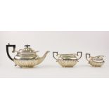 An Edwardian three-piece silver tea service by Charles Westwood & Sons, Birmingham 1901, each