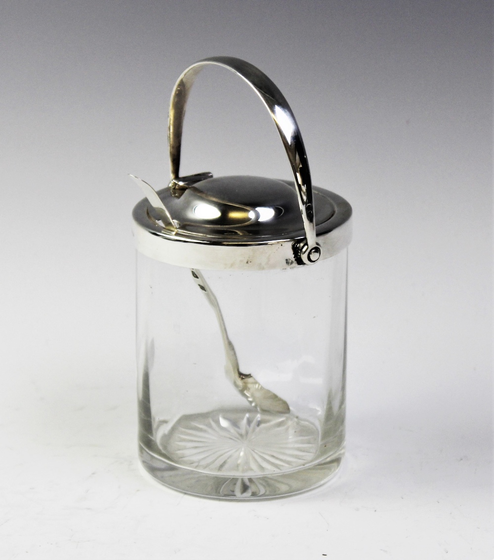 An Asprey of London Patent silver topped glass preserve jar, of cylindrical form with mechanical