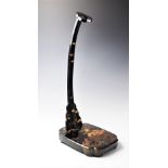 A Japanese lacquered katana stand, 20th century, gilt highlighted against roiro ground