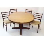 A mid 20th century Danish rosewood pedestal dining table, by SVA, supplied by Heals of London,