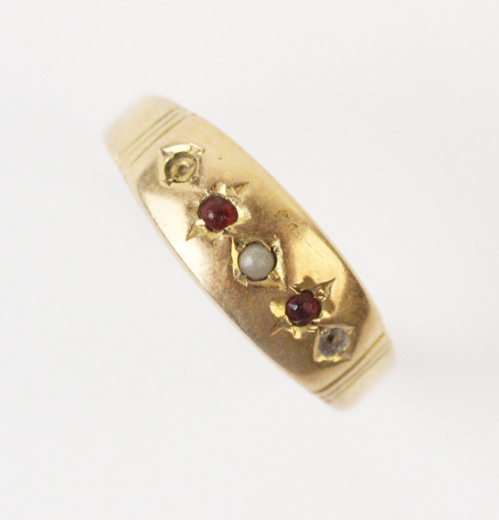 An early 20th century ruby and pearl set ring, comprising a small seed pearl with a small mixed