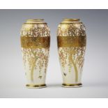 A pair of Japanese Satusuma vases, signed Seizan, each cylindrical vase extensively decorated with