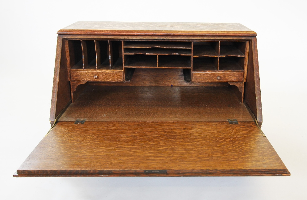 An early 20th century oak stacking bureau, the fall front enclosing a compartmentalised interior, - Image 2 of 2